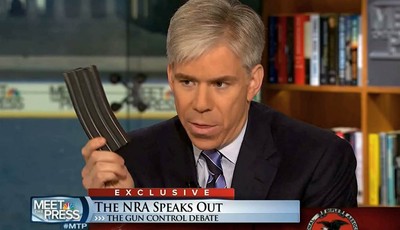 
              This video frame grab image provided by"Meet the Press" shows host David Gregory holding what he described as a high-capacity ammunition magazine during a recent Sunday